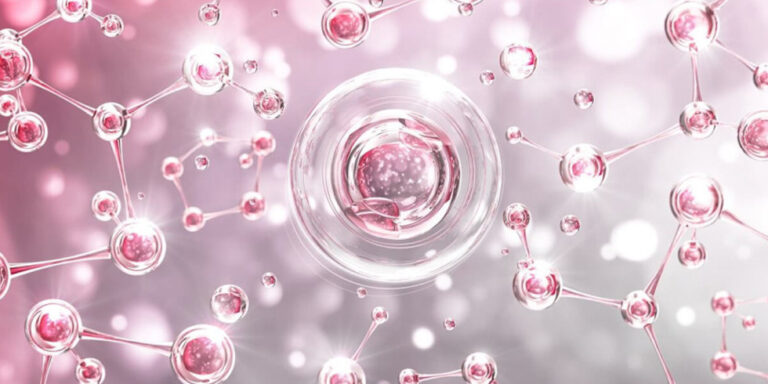 abstract illustration of pink and silver molecules and atoms connected by thin rods, with a large central sphere resembling a cell, set against a soft, blurred pink background. uk