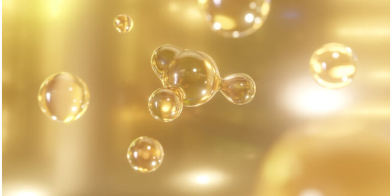golden bubbles of various sizes float in a soft, glowing, yellow golden background, creating a dreamy and luminous atmosphere. the bubbles have a shiny, reflective surface. uk