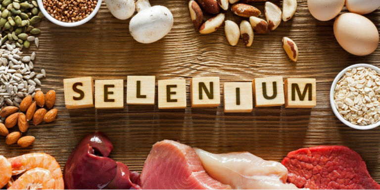 wooden blocks spelling selenium are surrounded by selenium rich foods, including nuts, seeds, eggs, mushrooms, seafood, meat, liver, and cereals, all arranged on a wooden surface. uk